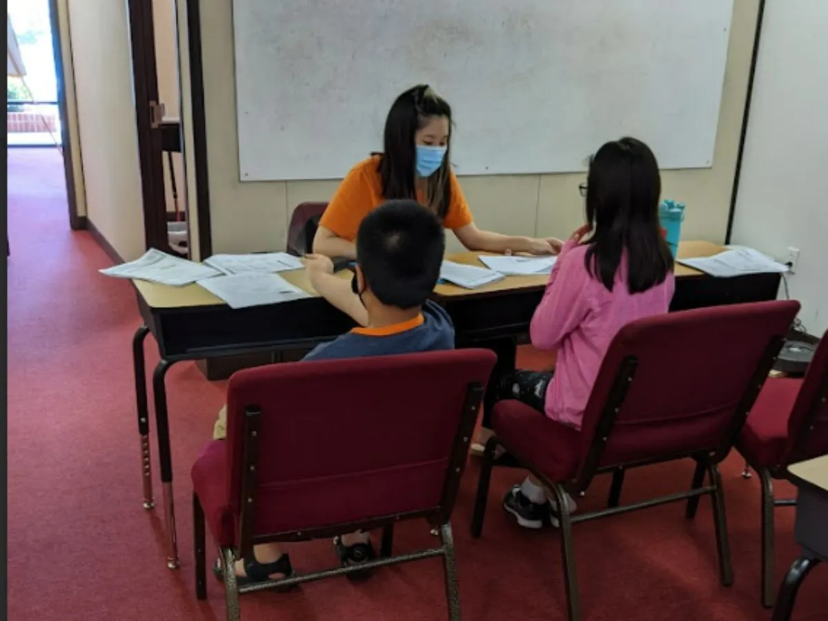 IQ Learning classroom with student receiving tutoring